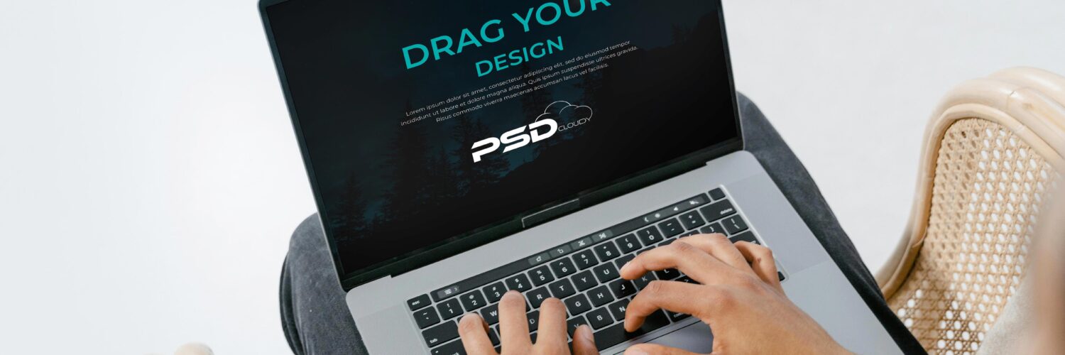 Free Person Using Laptop Mockup PSD