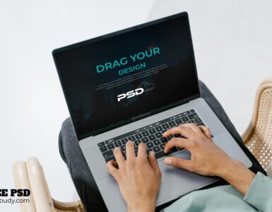 Free Person Using Laptop Mockup PSD